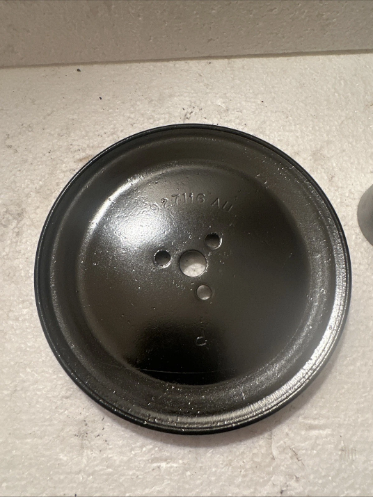Pulley, bracket, and diverter valve components arranged for identification