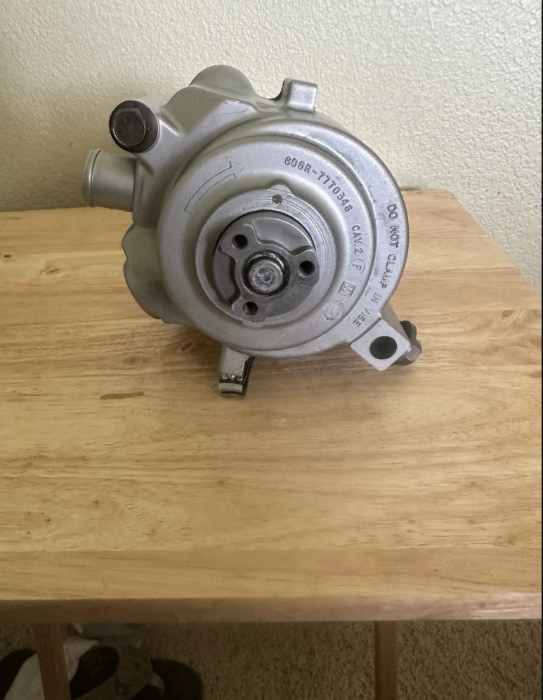 restored smog pump ready for installation on a vehicle