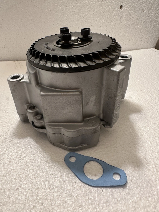 Professionally rebuilt emission pump prepared for vehicle installation
